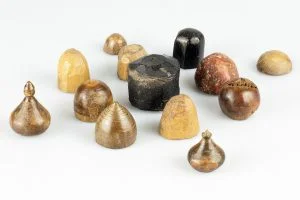 fig 1: Playing pieces made from bone, ivory, jet, and stone from the Coppergate excavations, which are on display at the Jorvik Viking Centre, © York Archaeological Trust