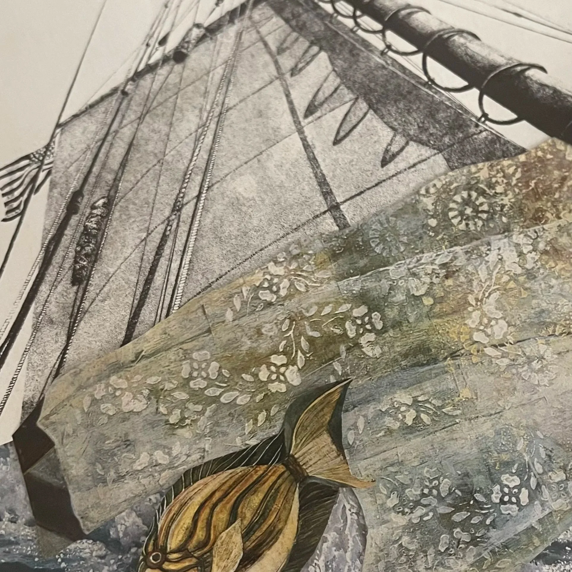 Collage art of a yellow and black fish swimming through choppy waters next to a boat with a white sail and a flower motif-decorated hull. The art is from the fish's vantage point