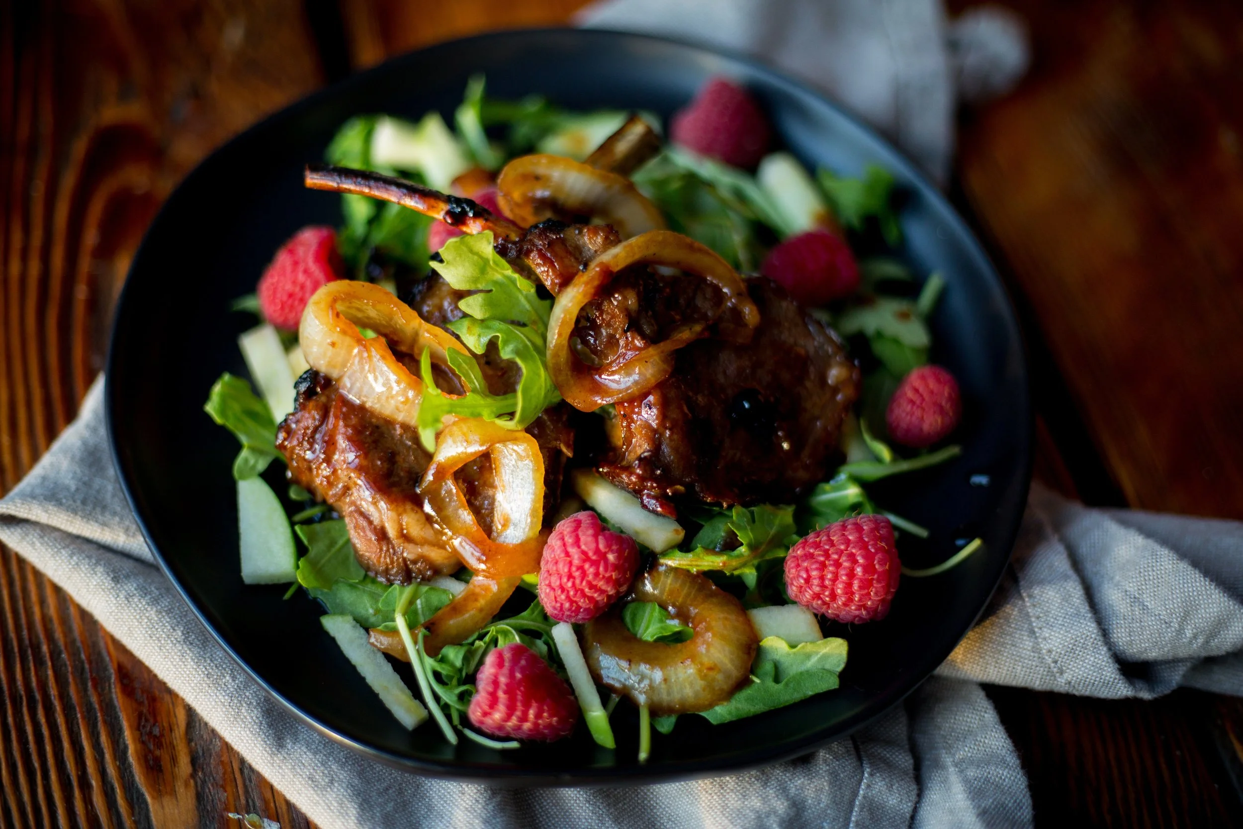Arugula, onions, lamb, raspberries…