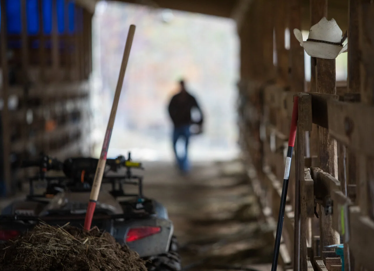  Charlie Musselman walks back from feeding horses in the stables at Smoke Rise Ranch on Friday, Oct. 30, 2020. Musselman Through working at the ranch, Musselman has made himself a home and family within the work. "Smoke Rise gave me something to figh