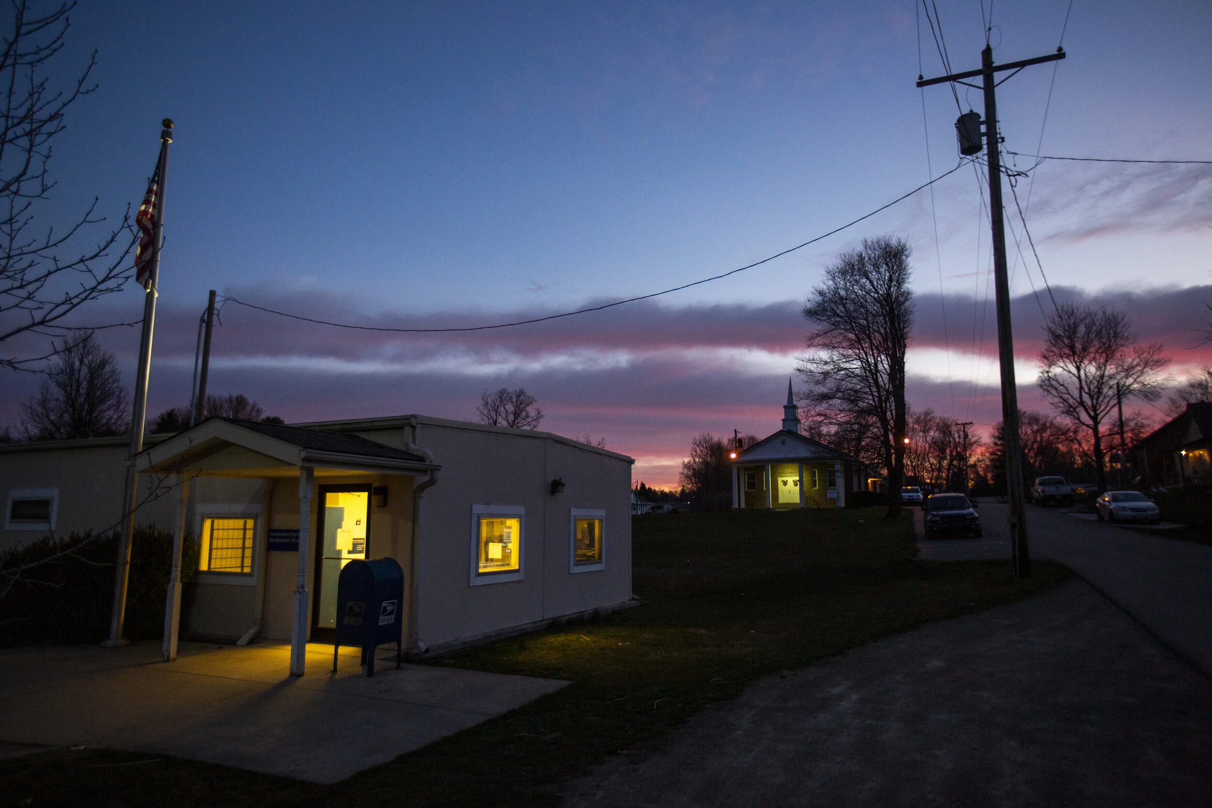  The sun rises on the center of New Marshfield on Monday, March 15, 2021. Moore moved to New Marshfield later in life but said he enjoys living there. "It's not a bad town, everyone tries to help everybody from what I've seen," he said.  