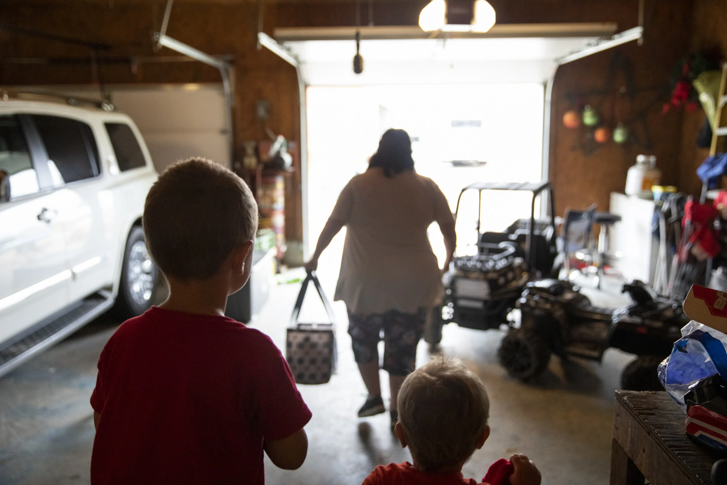  Silas and Mangus Shaulis watch as Danita McLaughlin heads back to her house after a day of looking after them on Sept. 23, 2021. Chris had said, while he knows they'd figure something out, he's not sure what his two daughters would have done if Dani