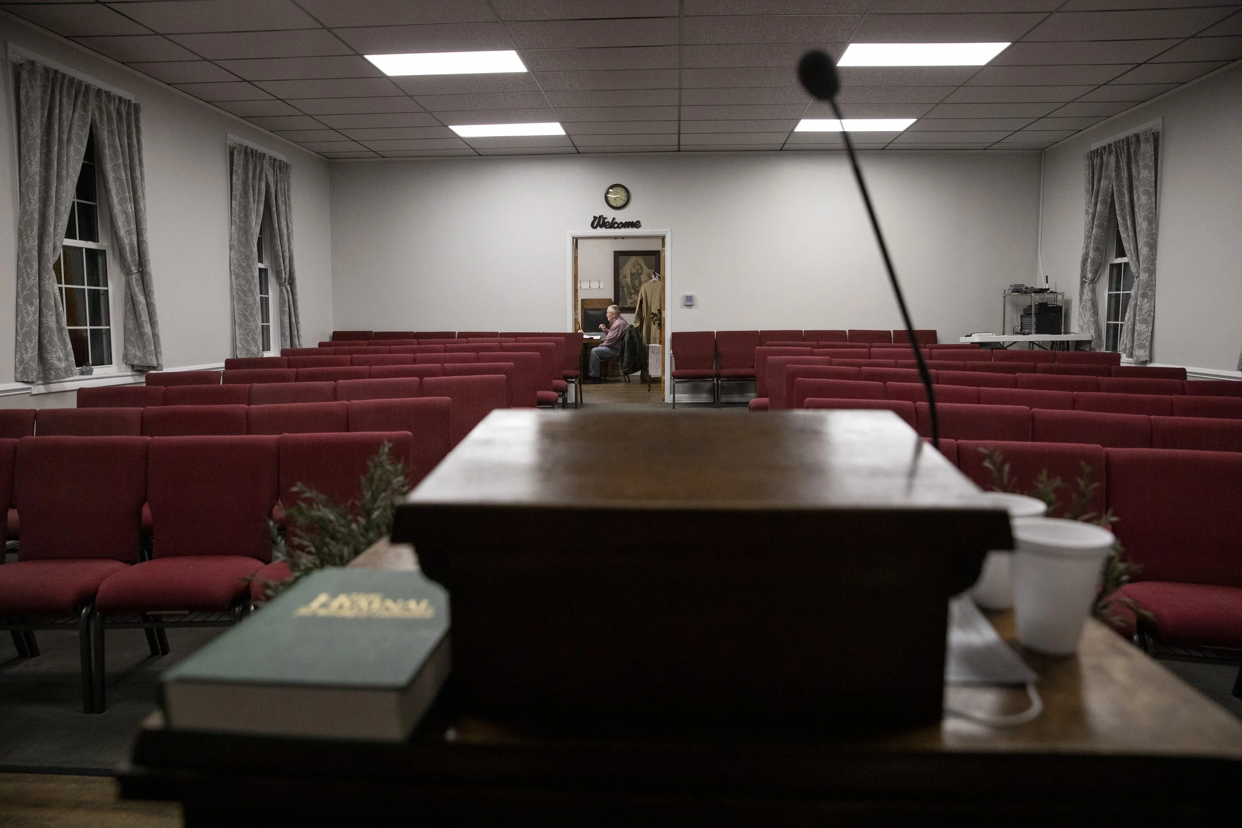  Pastor Willard Love leads a Wednesday Bible study in the back room of Airline Union Church outside Albany, Ohio. The Bible study was held in-person with some members choosing to join online through a livestream. Love has been a pastor for 53 years w