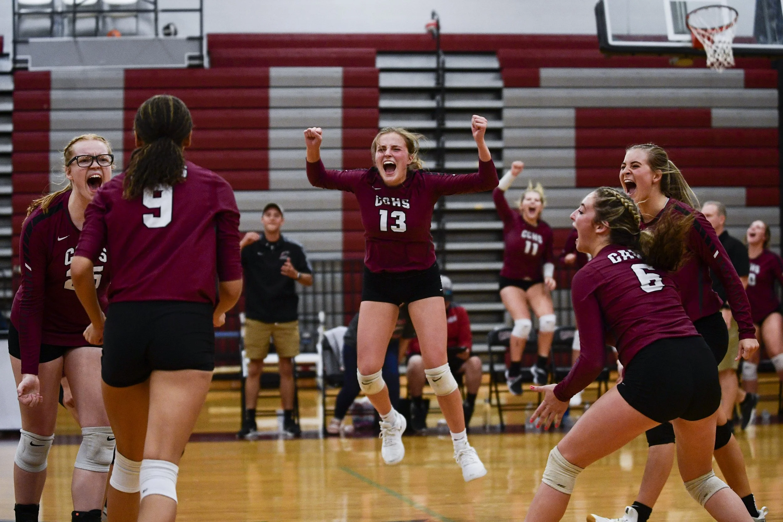  Crockett’s Bailey Ann Whitby (13) jumps in the air as she and her teammates celebrate winning a point during the game between Lexington High School and Crockett County High School on Tuesday, August 30, 2022, in Alamo, Tennessee.  