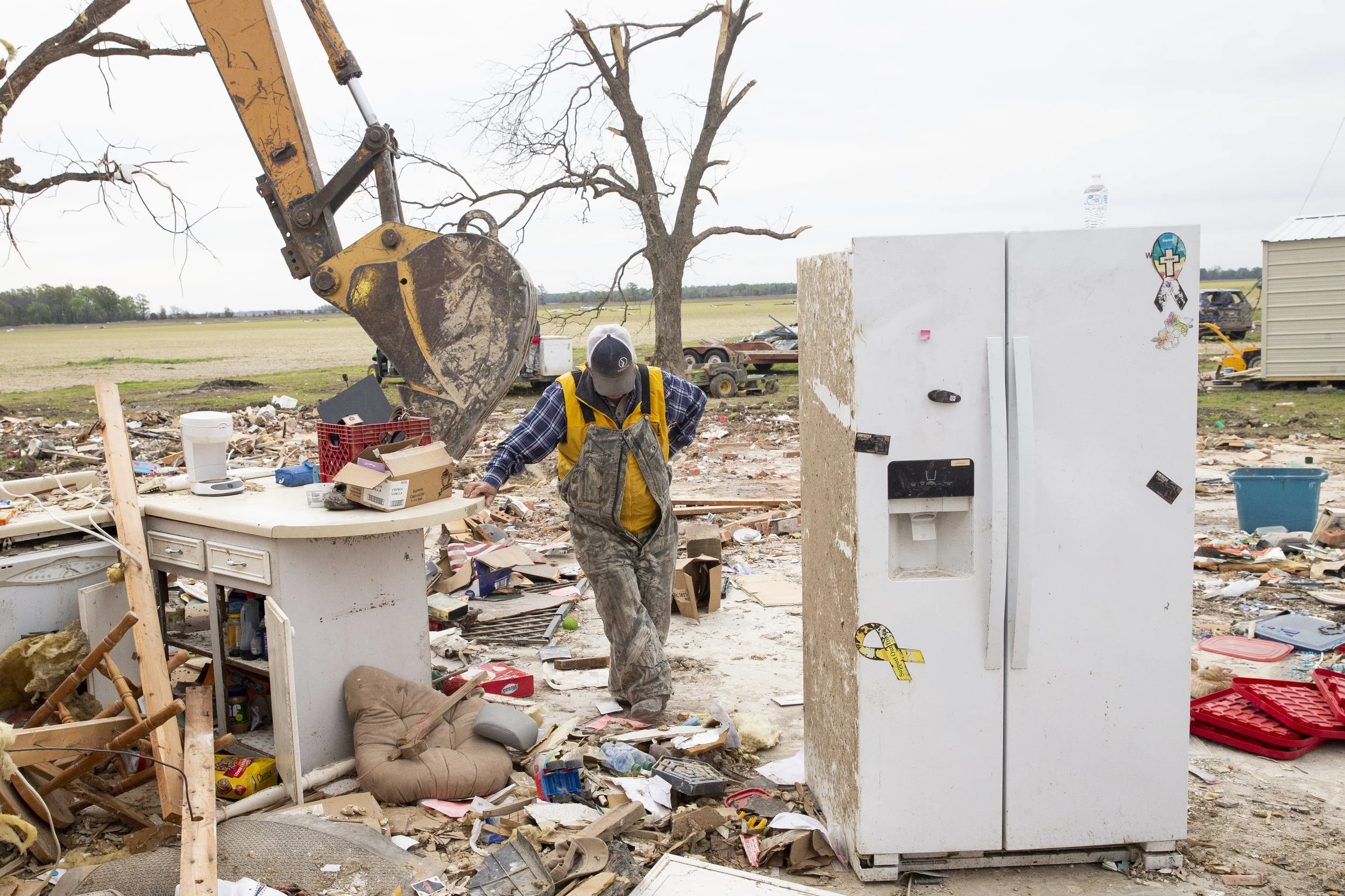  Joe Pruden looks down as he leans against the counter in what used to be the kitchen in his home on Seven Mile Road outside Midnight, Miss., on March 29, 2023. Recovery efforts continue after an EF-4 tornado came through the area last Friday night. 