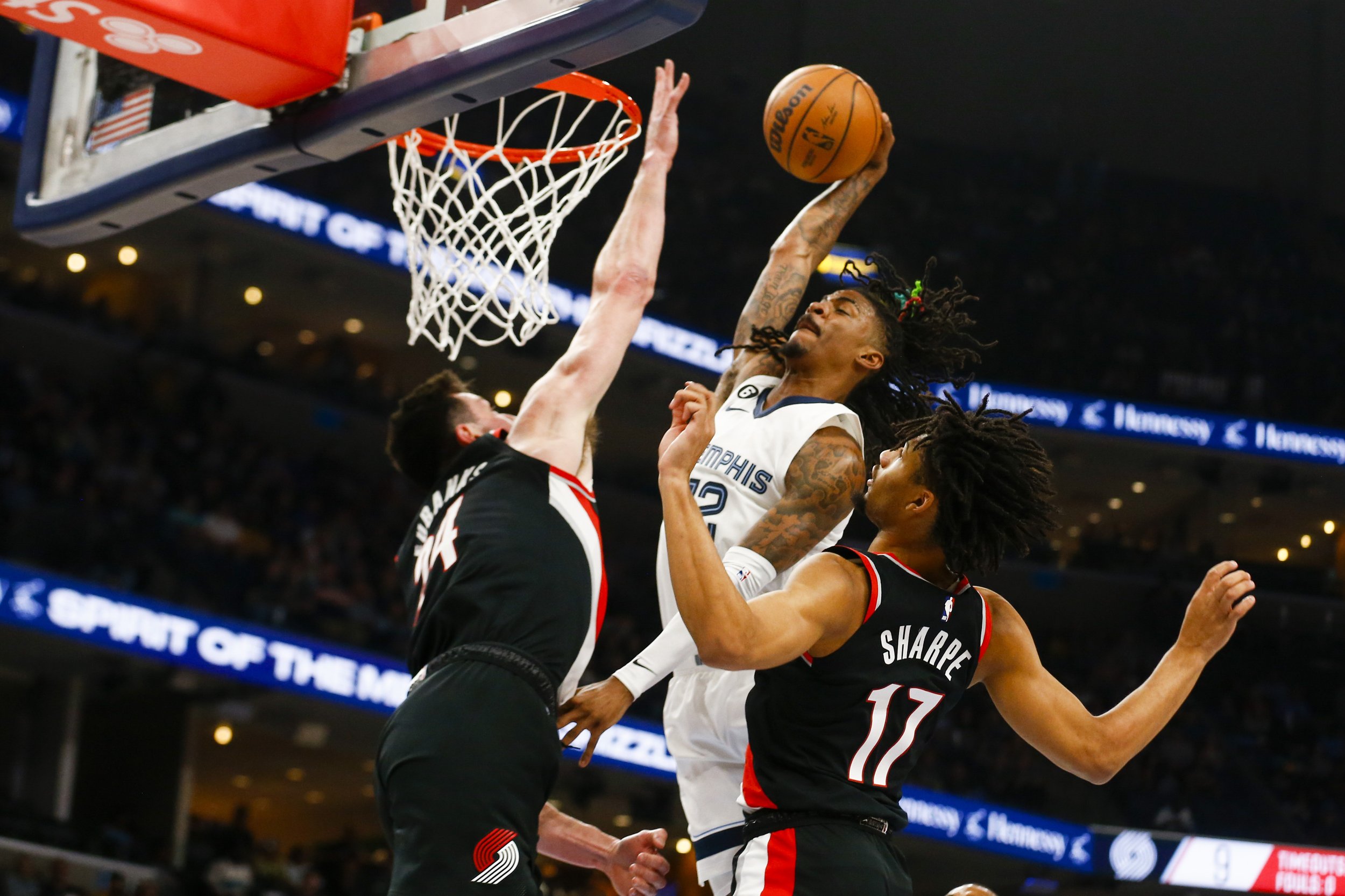  Grizzlies' Ja Morant (12) goes for a dunk during the game between the Memphis Grizzlies and Portland Trail Blazers at FedExForum in Memphis, Tenn., on April 4, 2023. 