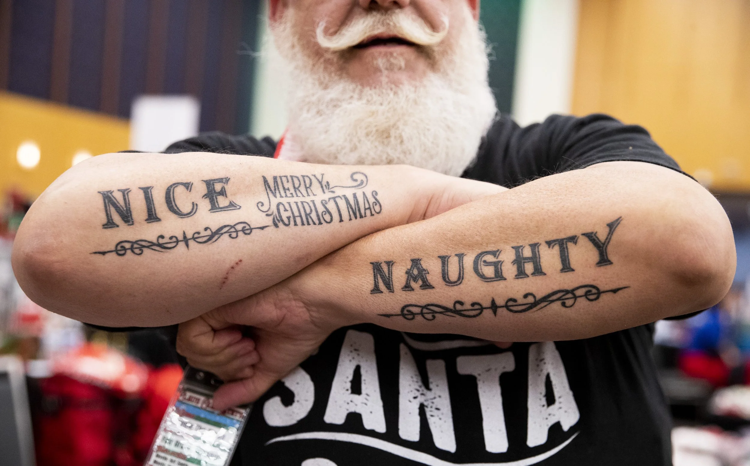  Spangle the Clown shows off his “naughty” and “nice” tattoos during the 2024 International Santa Celebration in Downtown Memphis on Friday, April 26, 2024. The event brings professionals working as Santa or Mrs. Claus together to learn, network and 