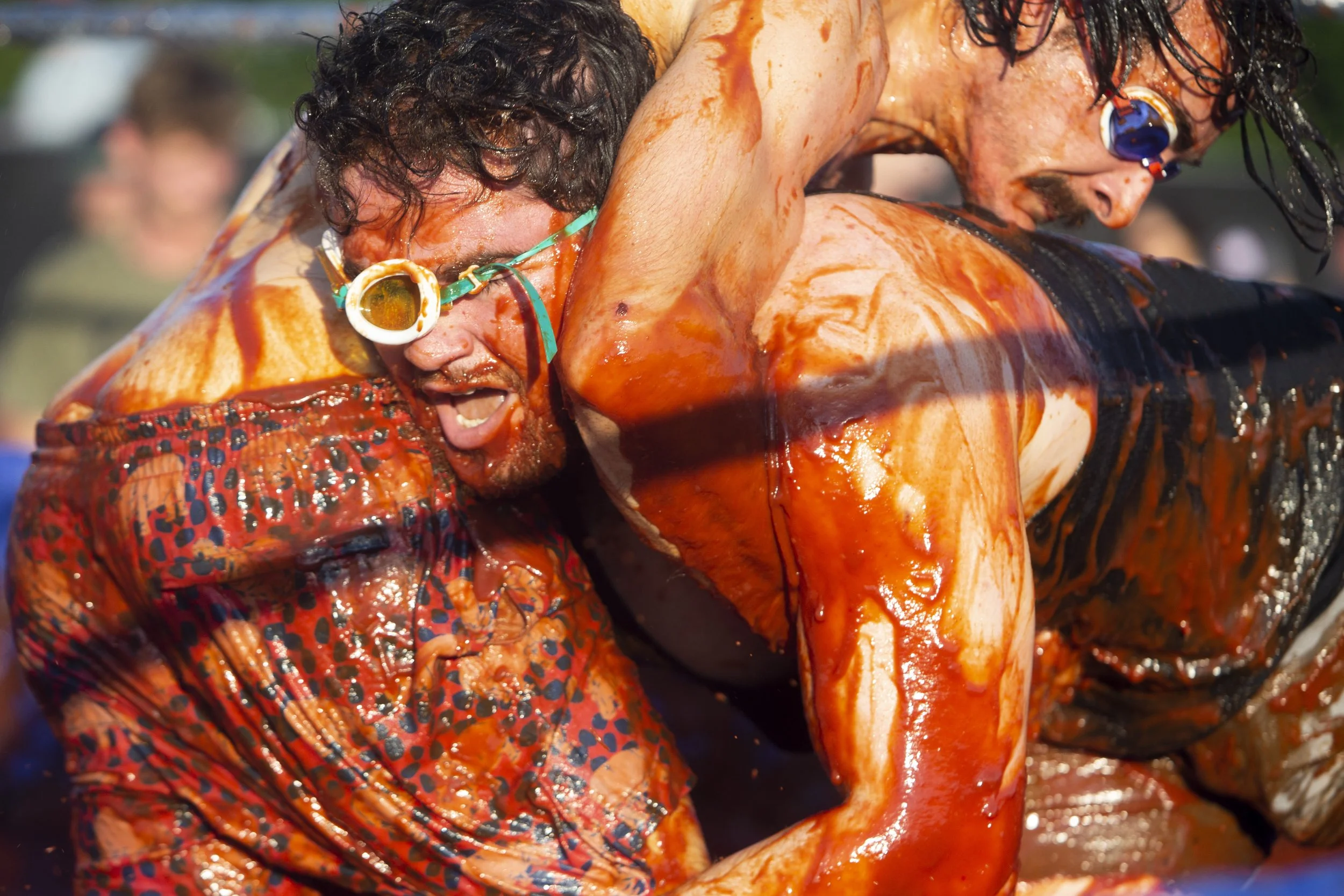  Bryce Whitman with Sweet Brown Smokers and Chris Coles with Sow Luau wrestle in barbecue sauce during the World Championship Barbecue Cooking Contest as part of the Memphis in May International Festival in Memphis, Tenn., on Wednesday, May 15, 2024.