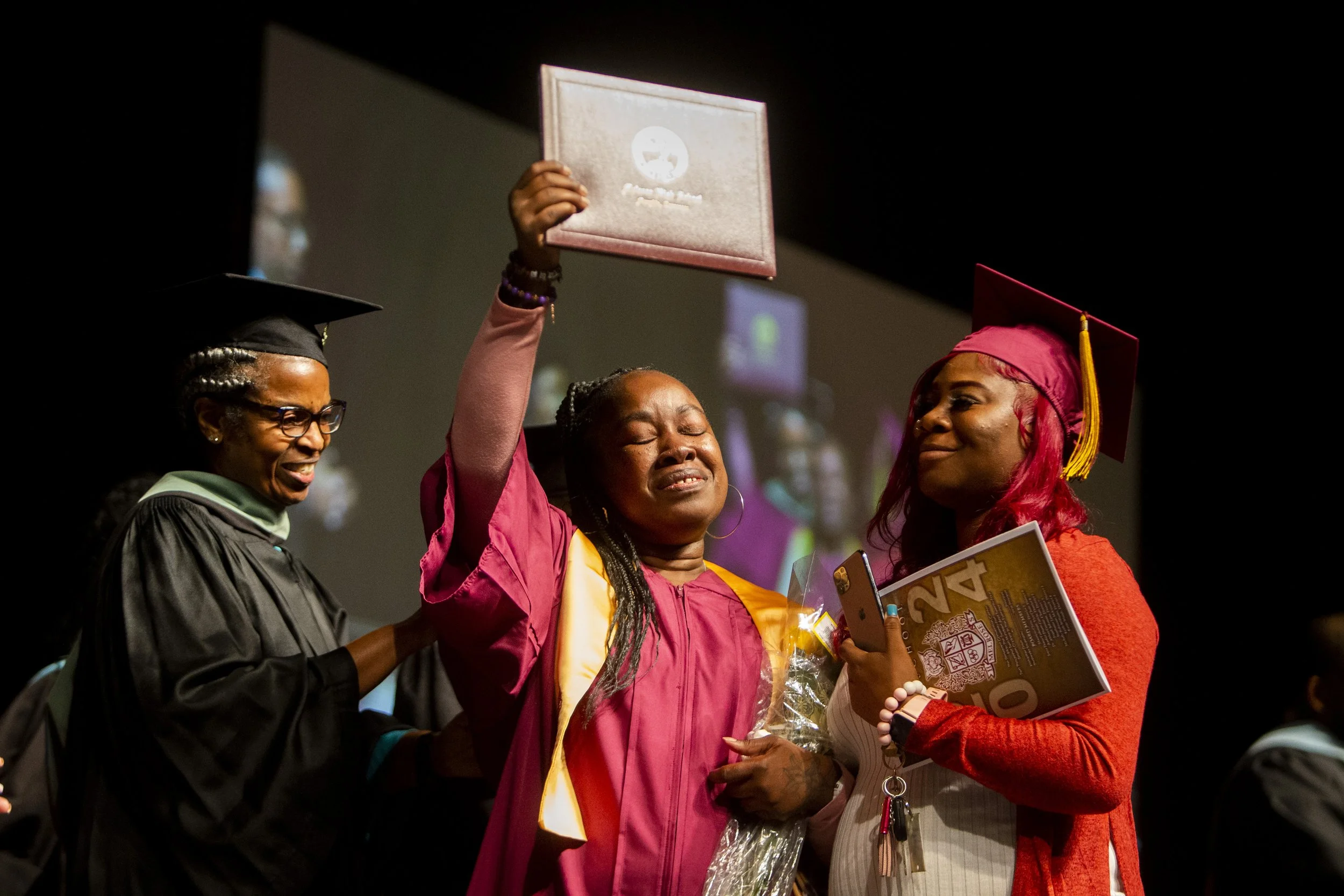  Jeaneen Tankersly-Jones, the mother of Xavier Tankersly, who was shot and killed in March 2023, walks across the stage and receives her son’s diploma during the graduation ceremony for Melrose High School at Renasant Convention Center in Memphis, Te