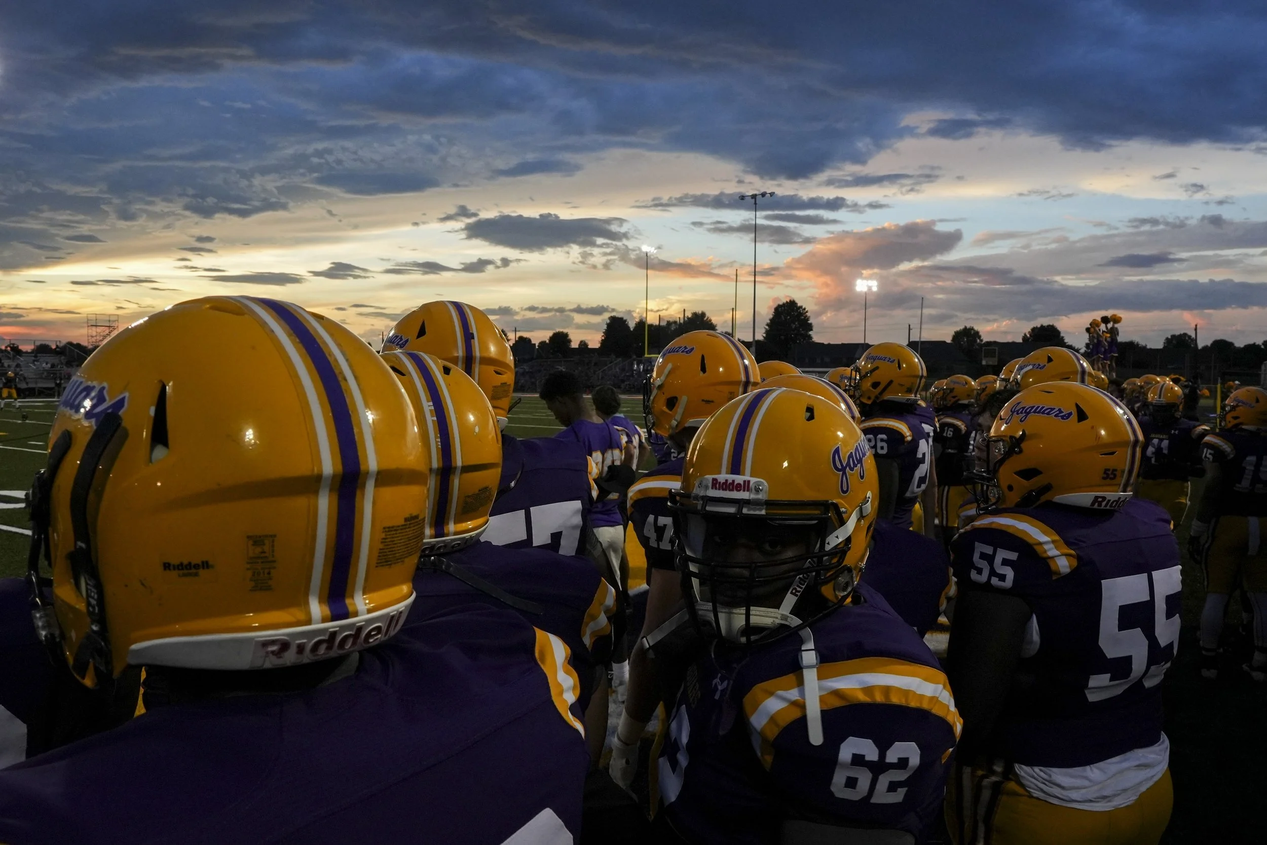  The sun sets over the DeSoto Central sideline during the game between Houston High School and DeSoto Central High School in Southaven, Miss., on Thursday, August 29, 2024.  