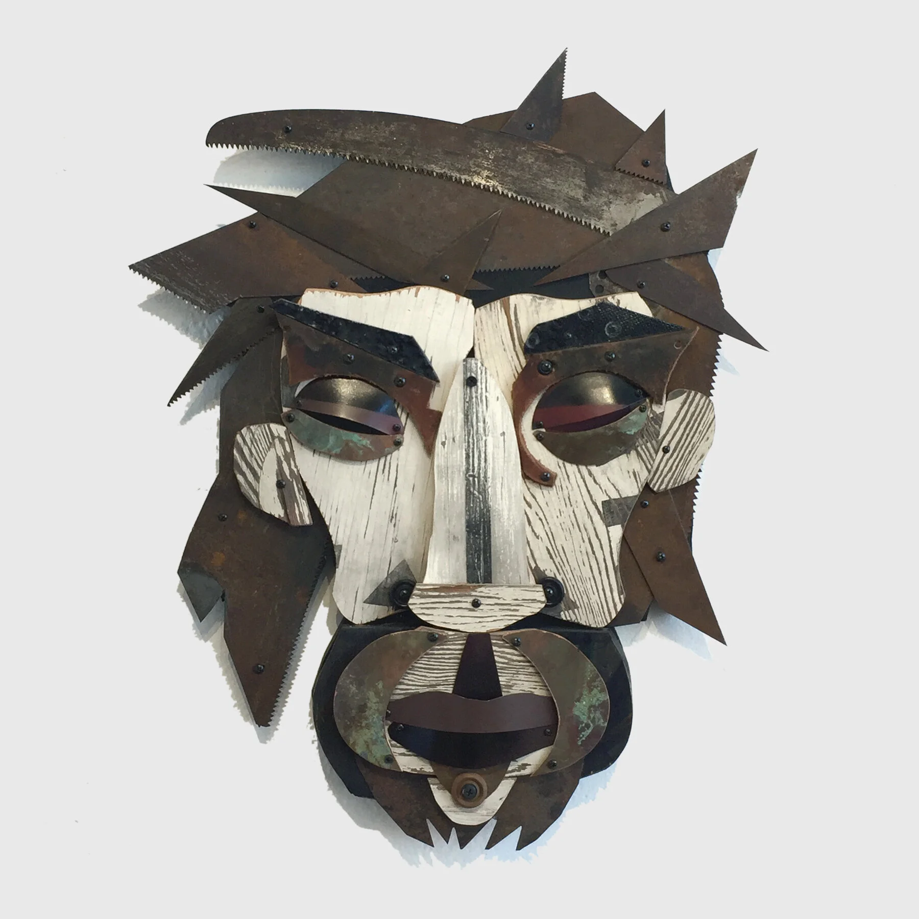 holy man - 23” x 22” x 3”, reclaimed wood sign, saw blades, metal, leather. $550.
