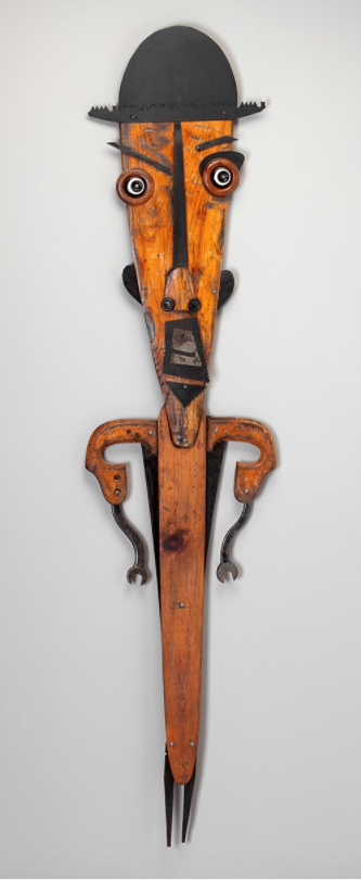 portrait of professor x - 52” x 12” x 2”, canoe paddle, saw blades, wrench, saw handle. $500.
