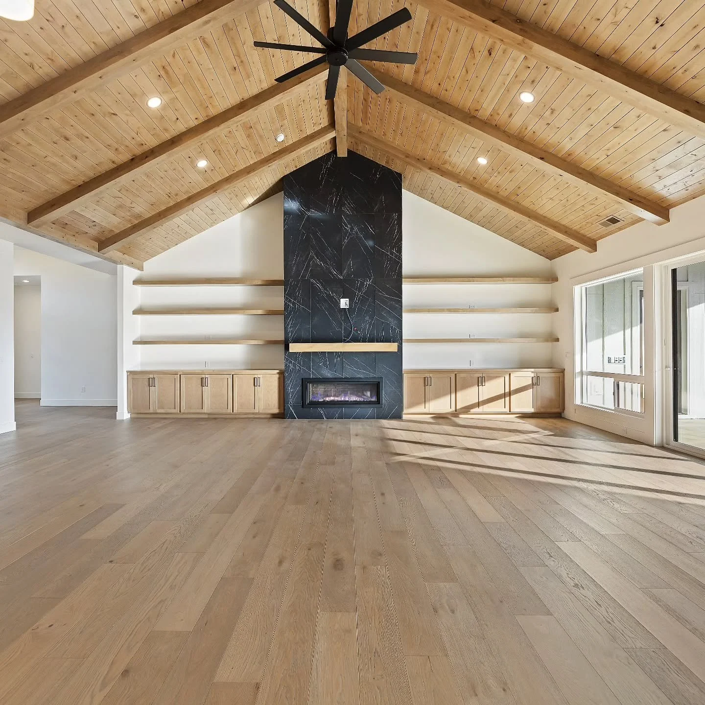 This is one of our favorite living rooms and entertainment areas we built for a client in our development, Weatherby Estates. 🖤