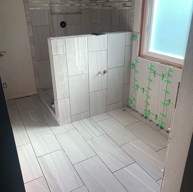 Finally got all the tile laid on this project...grout on Monday and then get it all put back together! New vanity, freestanding tub, and new trim to wrap it all up! Homeowners are going to love their new bathroom when it&rsquo;s all done! #dreambathr