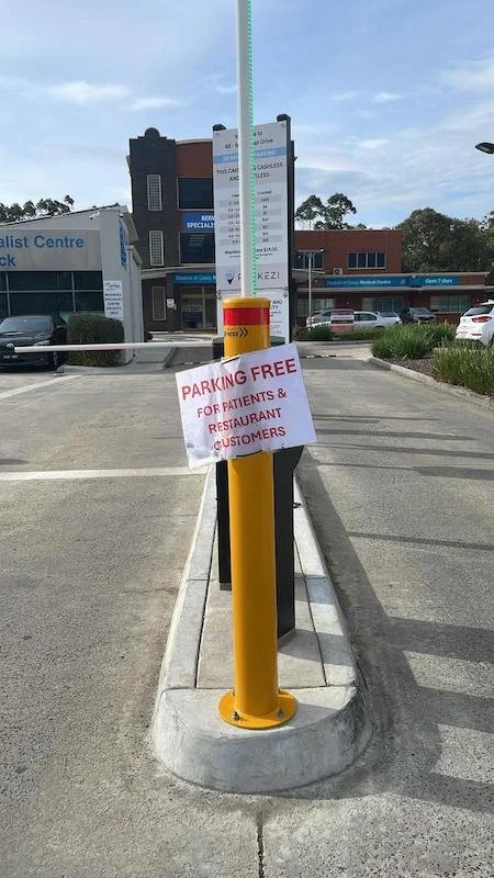 Free parking sign outside Berwick Podiatry Group, showing convenient patient parking available for visitors attending podiatry appointments in Berwick.