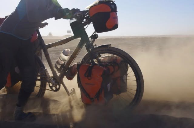 BAMBOO ODYSSEY: SOMETIMES RIDING MEANS WALKING

Somewhere in Kazakhstan, the sand got too deep to ride.

So we pushed.

A heavily loaded bamboo bike, panniers, dust, deep sand ... and no prize for trying to ride something that simply wasn&rsquo;t rid