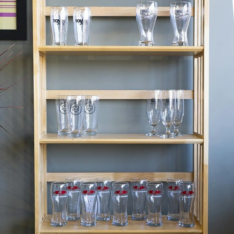 Ninety-nine pint glasses for sale on the shelf, ninety-nine glasses for sale... For a limited time, grab a pint glass from one of our favourite local breweries for $1 with any purchase of beer at #DrinksandDragonsCafe! The best merch to rock at home 