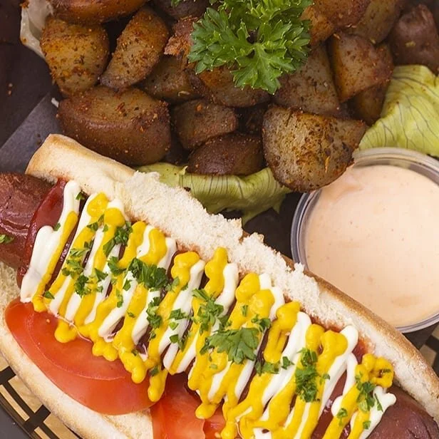 Officially introducing our new barbecue menu with @the.hungry.moon! They're here at #DrinksAndDragonsCafe grilling up a storm from 12pm-8pm, Tues to Sat 🌩 We've got hot dogs, burgers, wings, ribs, and jerk chicken, and your choice of roasted potatoe