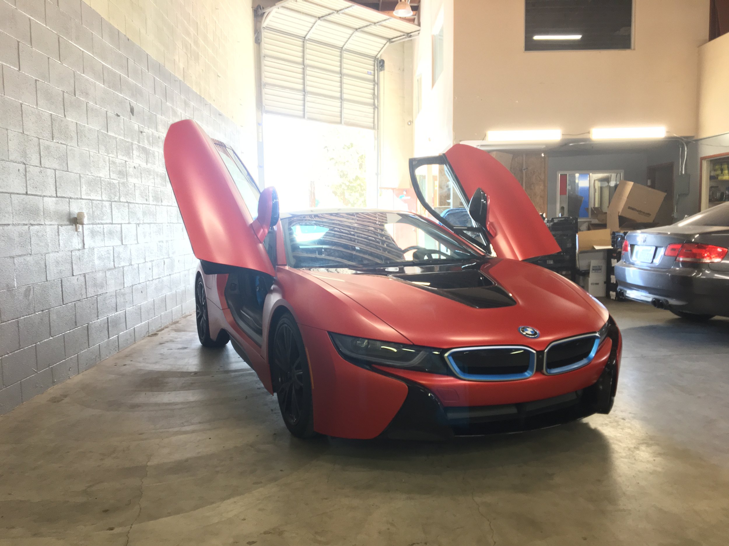  BMW i8 wrapped in 3M satin smoldering red. 