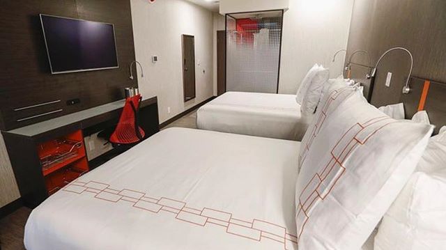 Our double queen room has ambient lighting, under-bed storage, a desk fitted with outlets, drawers, and an amazing chair, and the comfiest beds in Springfield! -

Check our room rates online: https://www.vibspringfield.com/