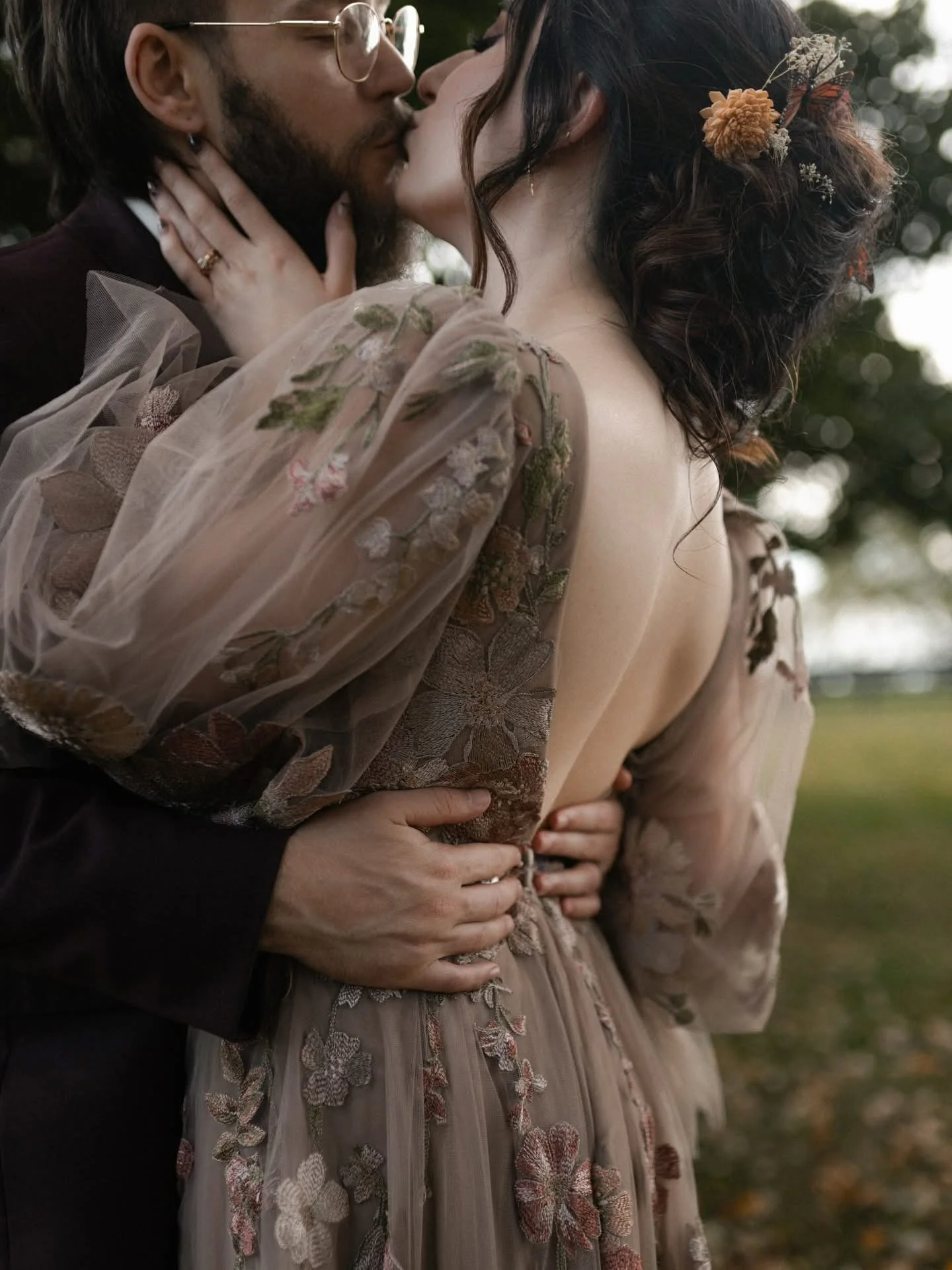 some couples want timeless. some want trending. faith &amp; cody wanted true &mdash; to who they are, what they love, and how they show up in the world.

tattoo station during the reception. embroidered florals and butterflies. Ring fingers in the br
