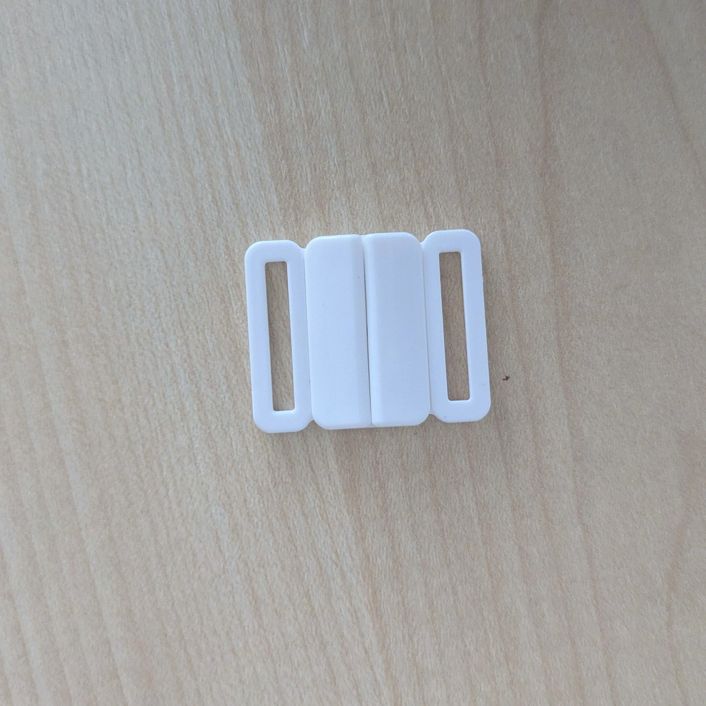 Attache de maillot de bain en plastique blanc