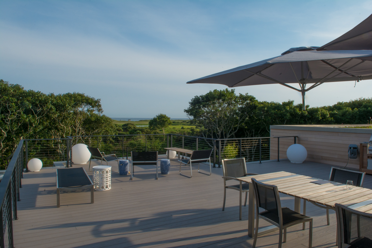 Beautiful deck with views to through the trees to the ocean