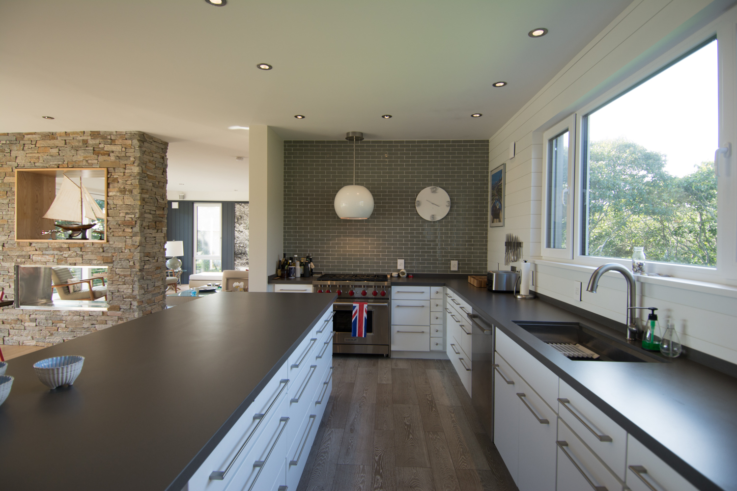 Modern galley kitchen with long window over the sink