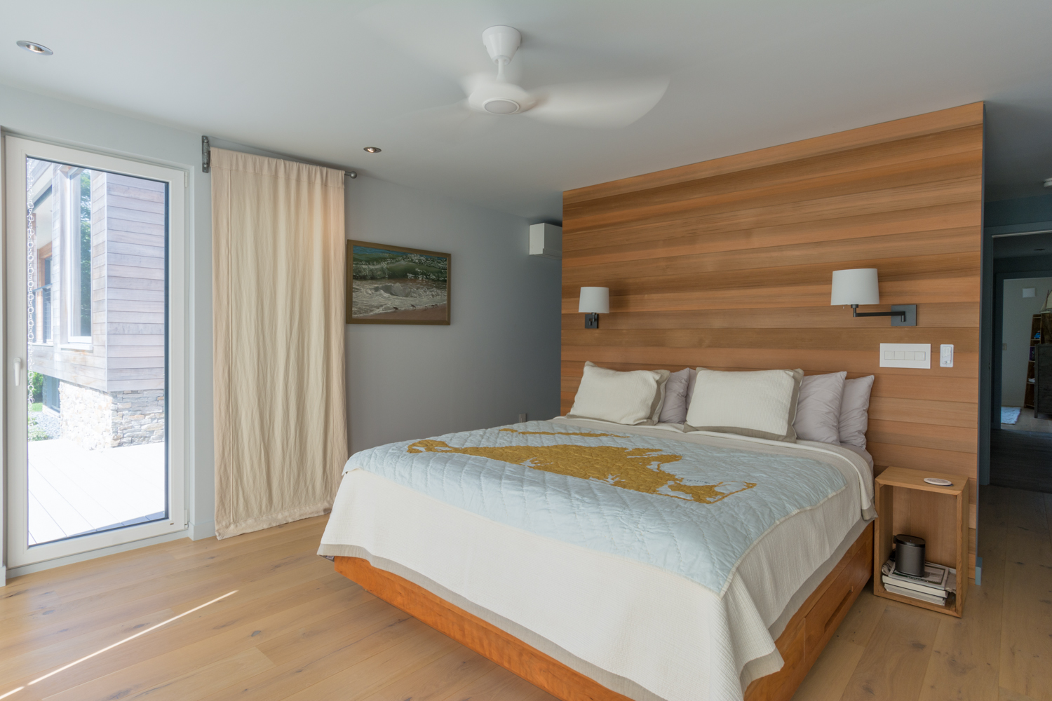 Bedroom with built in paneled headboard