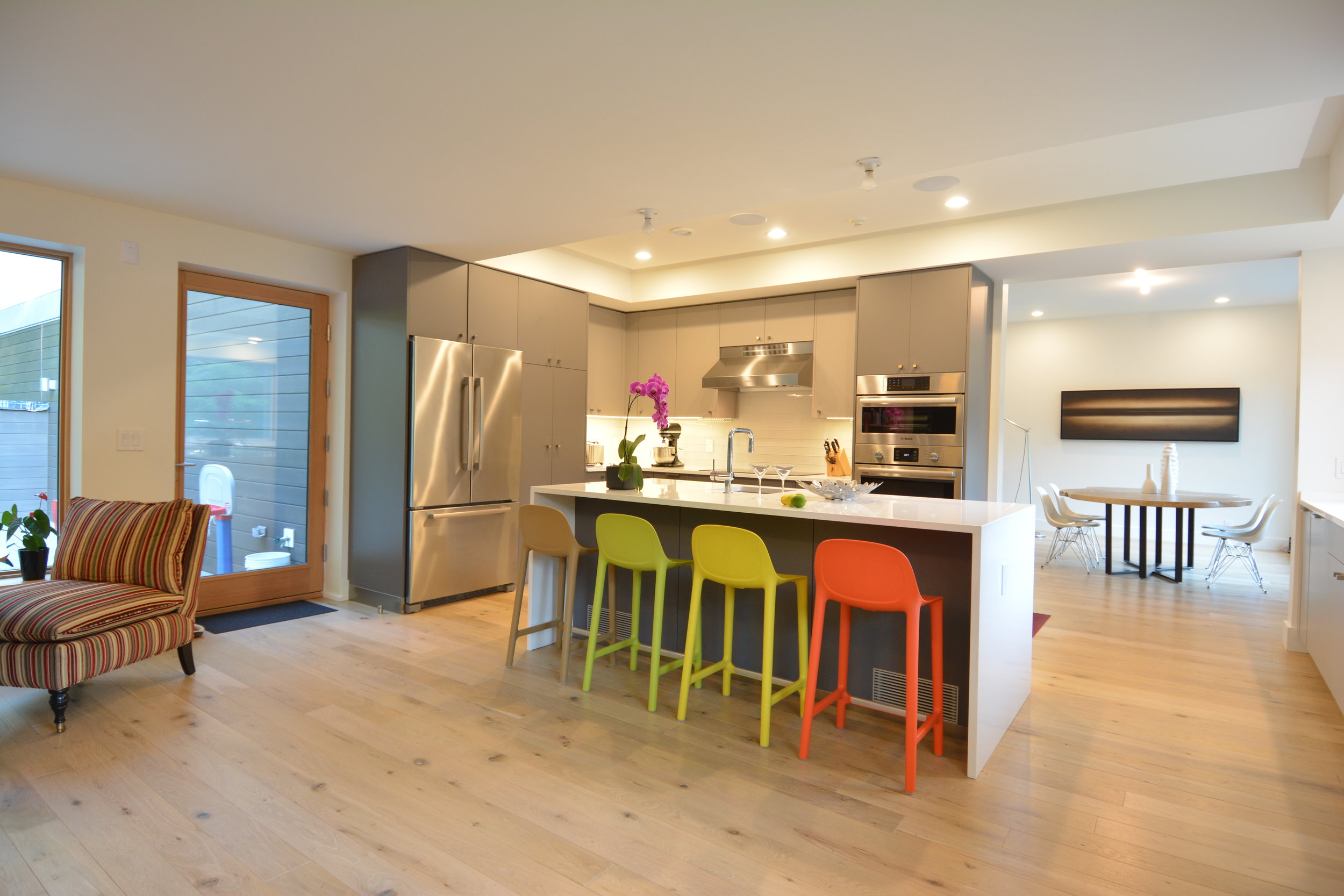 Breakfast bar and kitchen with colorful stools