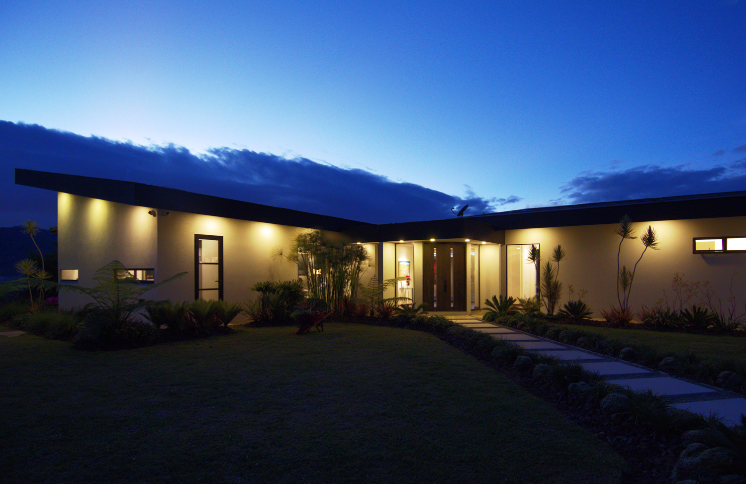 View of house at night, with beautiful sky