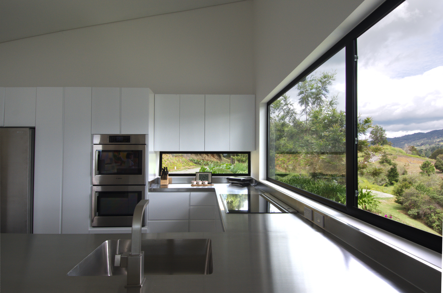 Kitchen with large windows and double wall oven