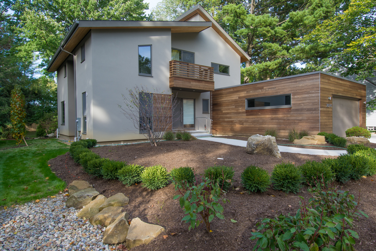 Exterior view of home with garage and balcony