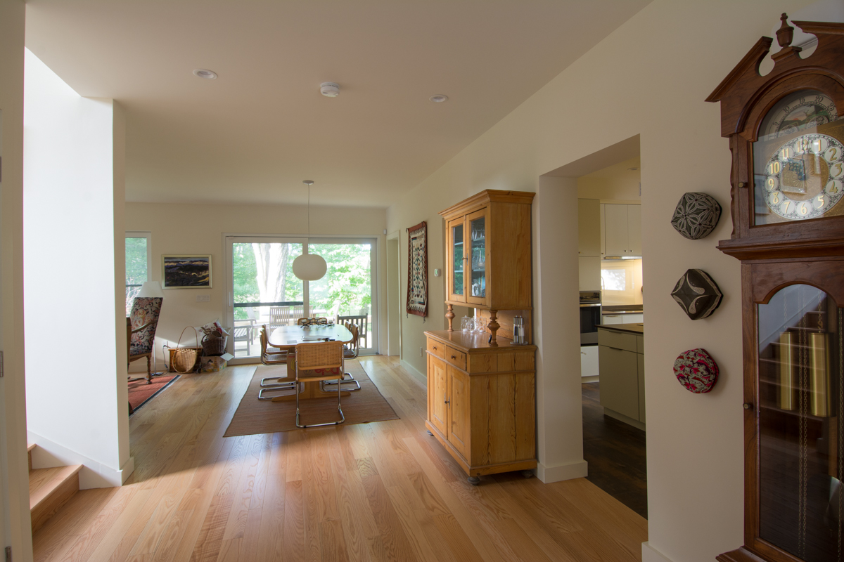 View through entry way and dining room to back of house.