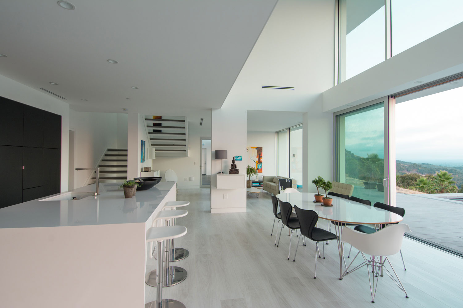 Open plan modern kitchen and dining room with view