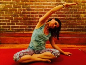 1-Seated-Side-Bend-Yoga-Shayna-Skarf-Textbookscom-Blog-300x225.jpg
