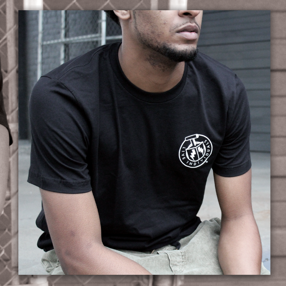 live individuals middle black shirt.png