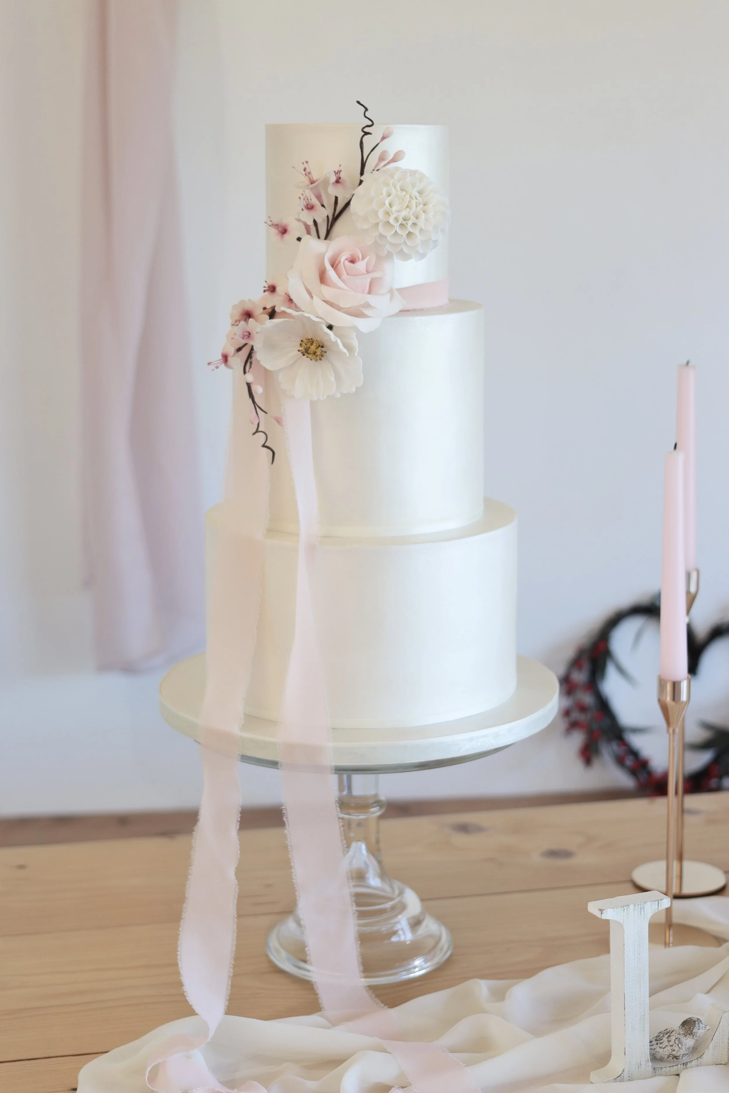 3 tier satin shimmer wedding cake with sugar rose, dahlia, cosmos and blossoms.JPG