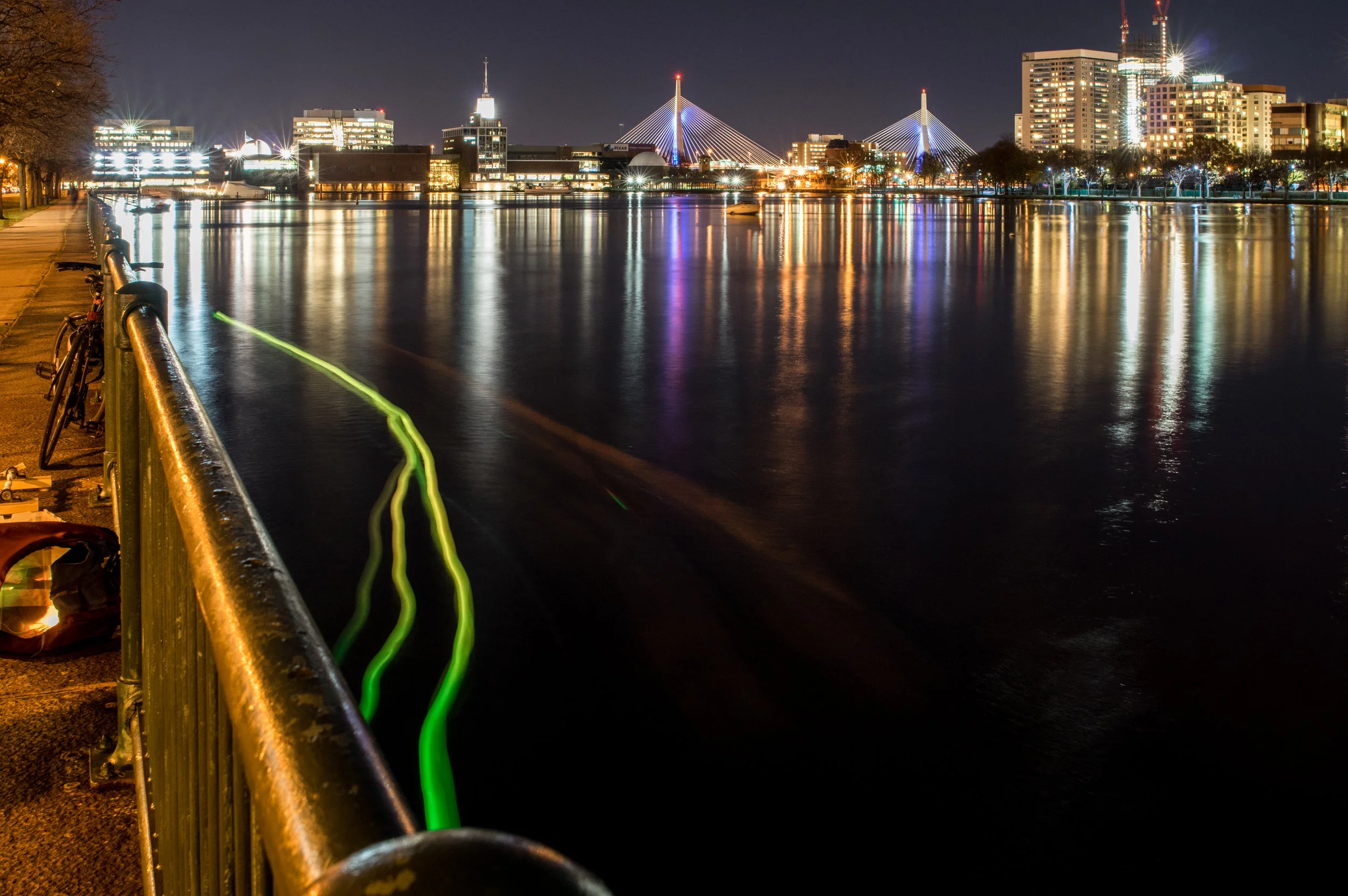 A long exposure image from an early SeeBoat test near the Kendall Cogeneration Station, November 20th, 2015. The change in color from green to yellow is tied to the temperature sensor readings and indicates a potential thermal pollution source near the outflow pipe. New infrastructure and protocols at the plant intended to eliminate thermal pollution were completed in 2016. SeeBoat: Kendall Cogeneration Station, 2015 // project: Laura Perovich & collaborators // photo: Jorge Valdez