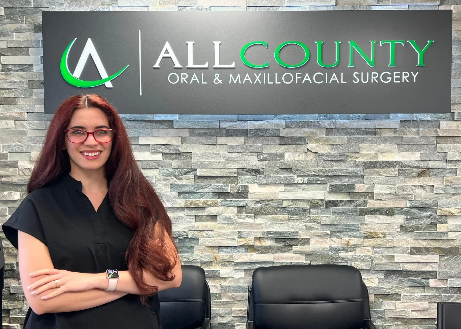 Dr. Amanda Andre posing in front of All county oral surgery flushing astoria brooklyn new hyde park
