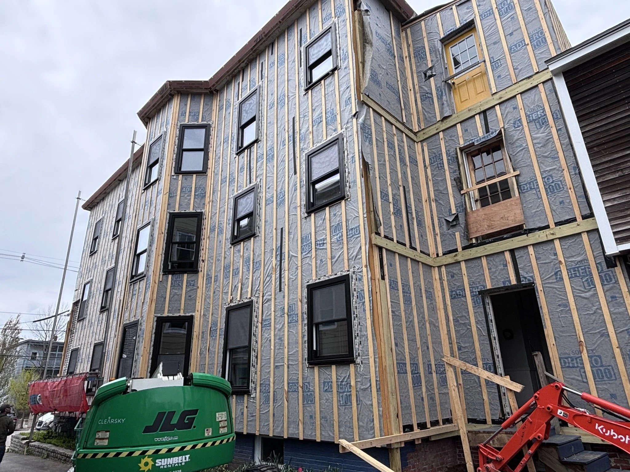 01 · Exposed WRB and rainscreen furring before siding.