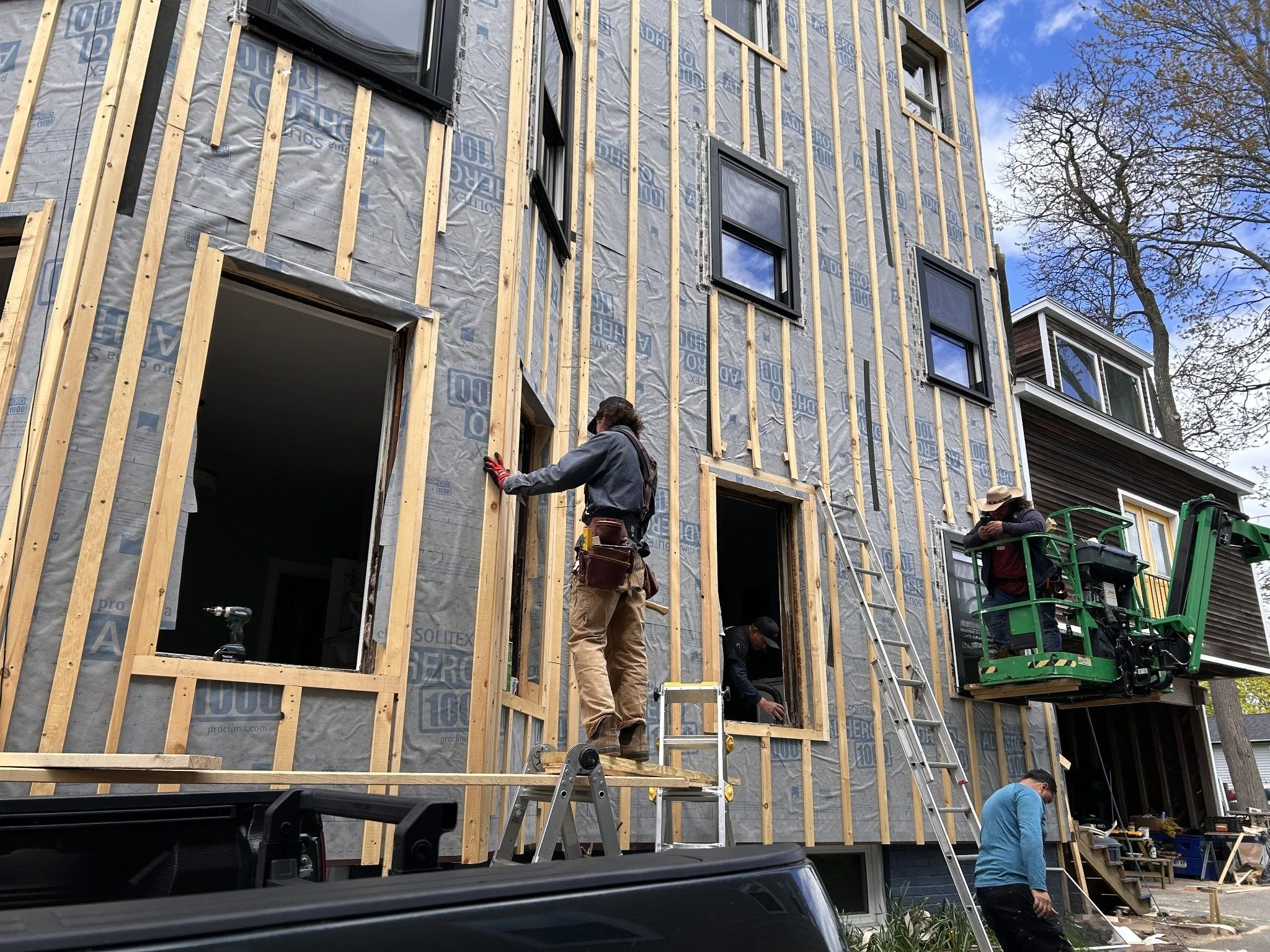 02 · The crew working on the envelope and window openings.