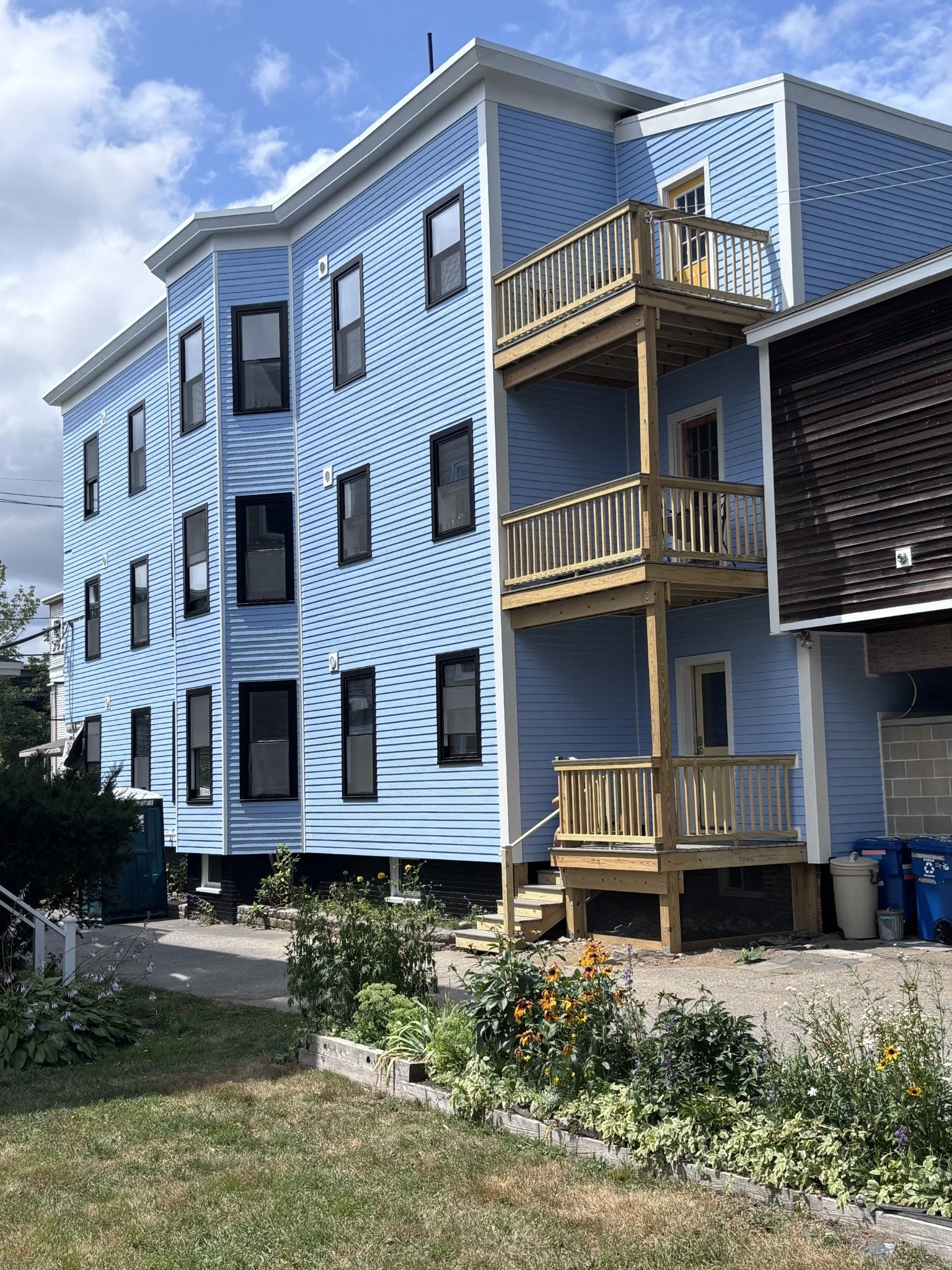 05 · The completed blue exterior and new decks.