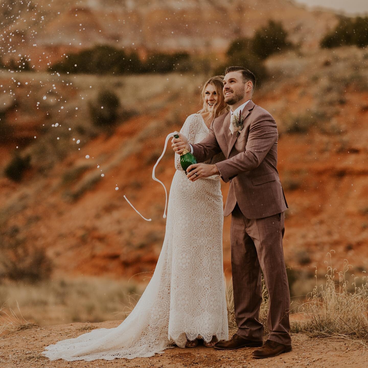 Pop the bubbly! Cheers to this incredible couple, Alexis + Josh. Their wedding was canceled in 2020. We made up for it with this session in Palo Duro Canyon! 🤍🥂🍾