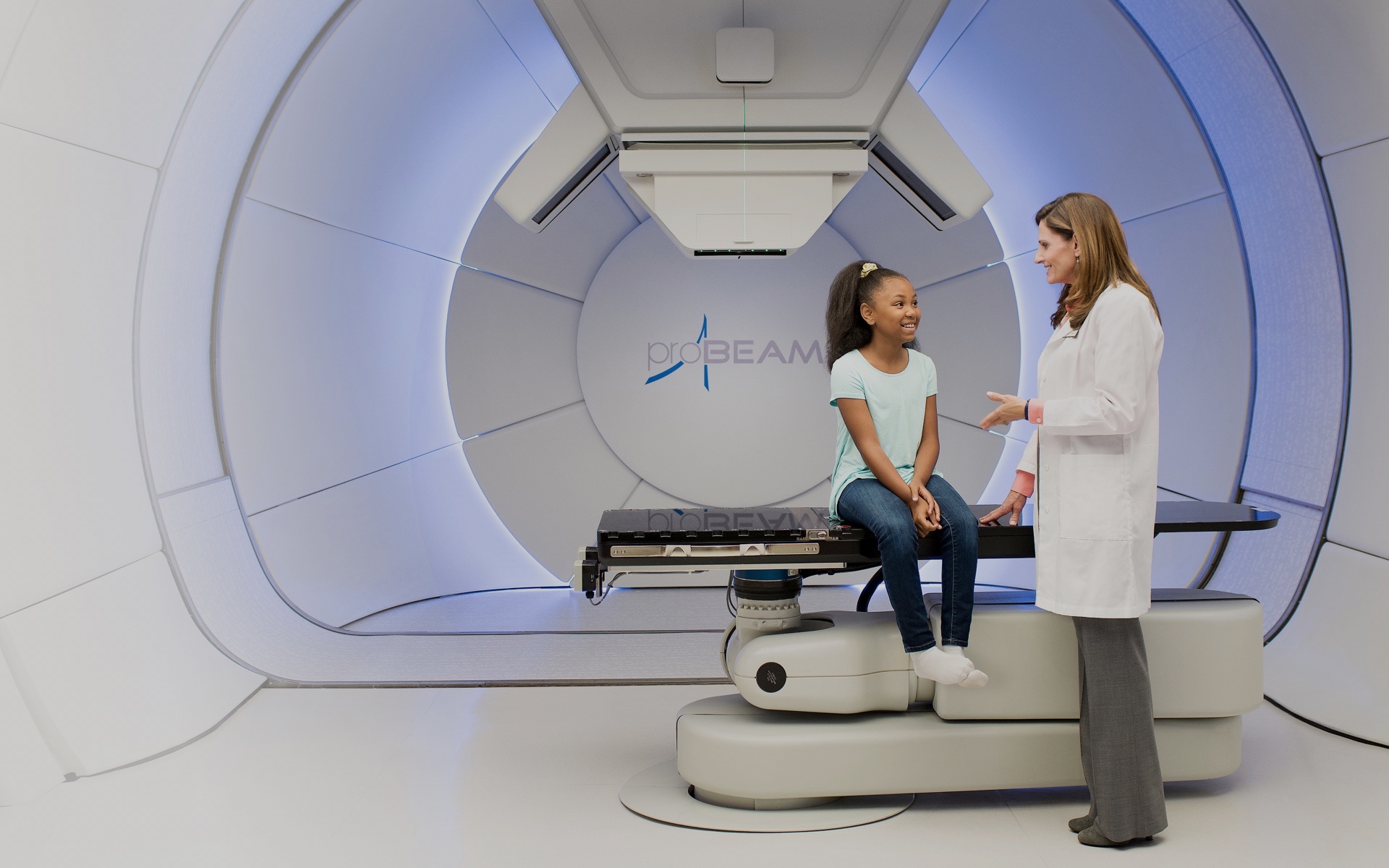 varian-probeam-proton-therapy-doctor-with-patient.jpg