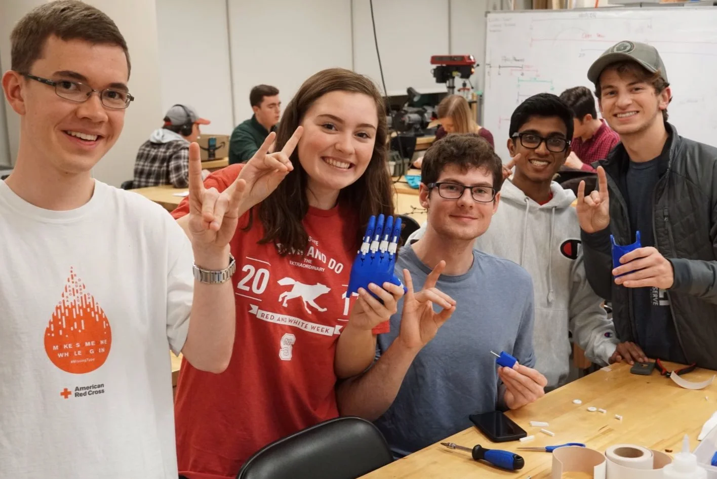 Students in the North Carolina State chapter work together to assemble 3D printed prosthetic devices.