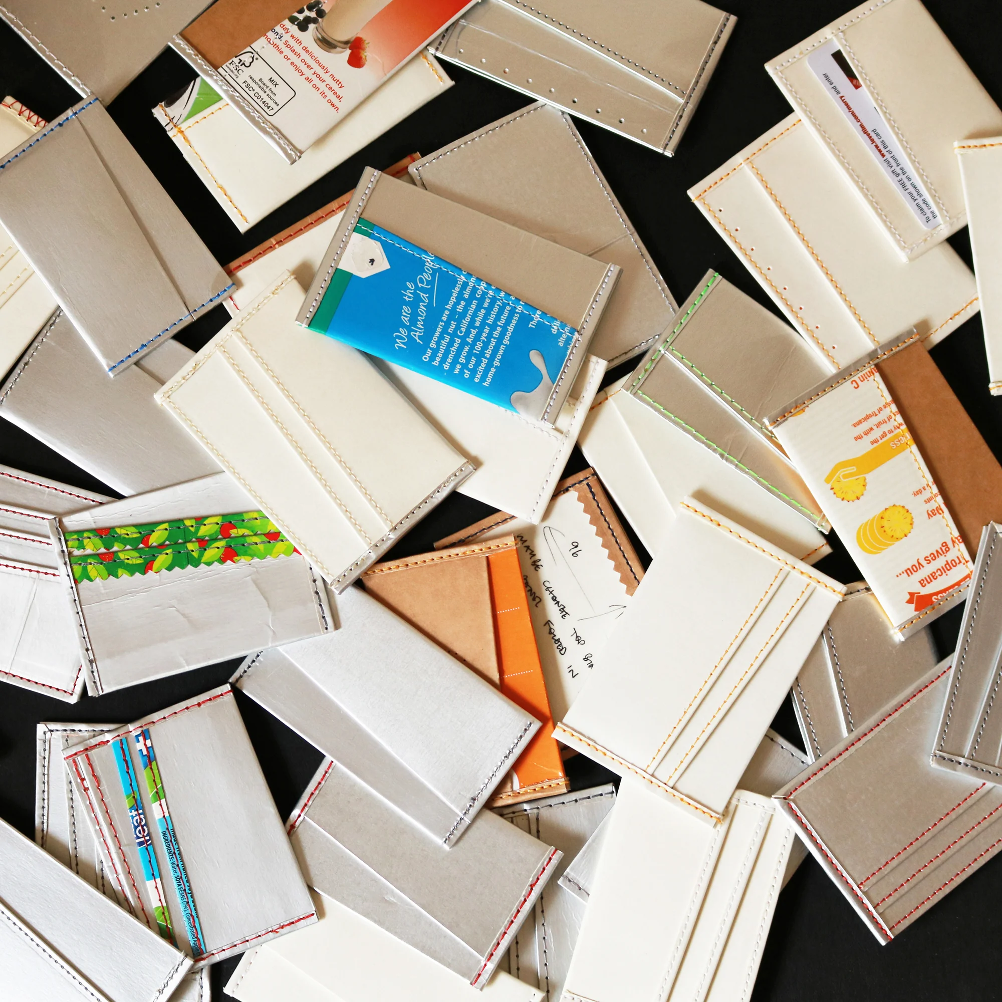 Various prototypes, development samples and construction experiments using upcycled juice and soy milk cartons.