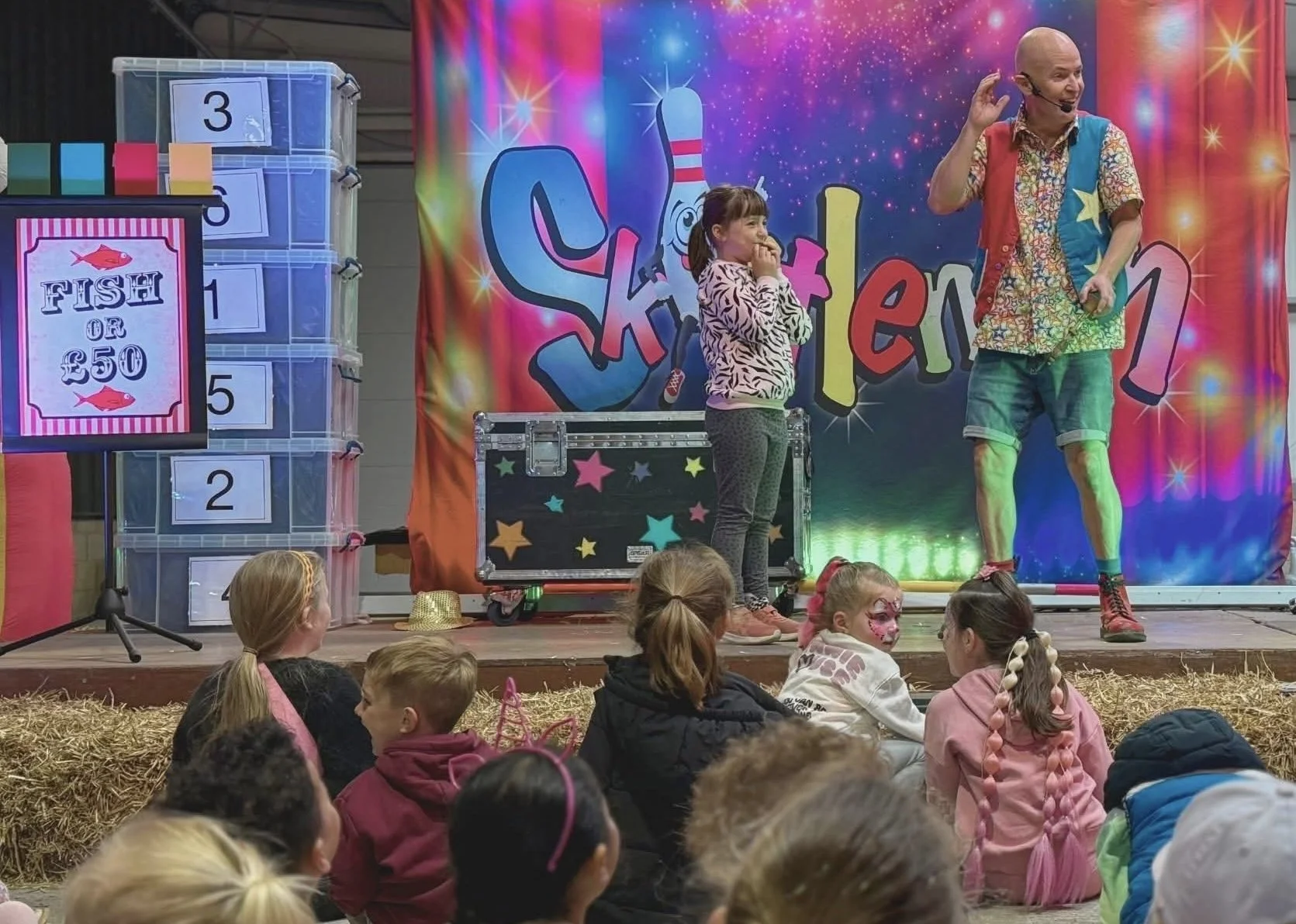 Skittleman entertaining families with comedy magic and fun at a mixed age event