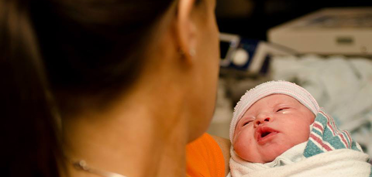Gina with her newborn daughter.