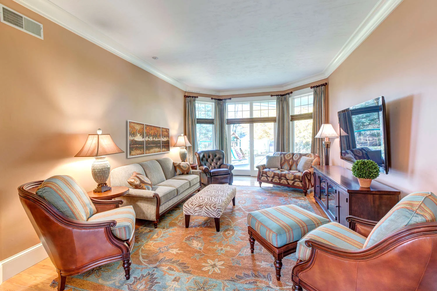 The sitting room has an Akbar hand knotted oriental wool rug and Fairfield Chair custom designed furniture.